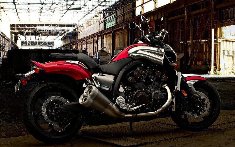 Red and silver motorcycle in warehouse