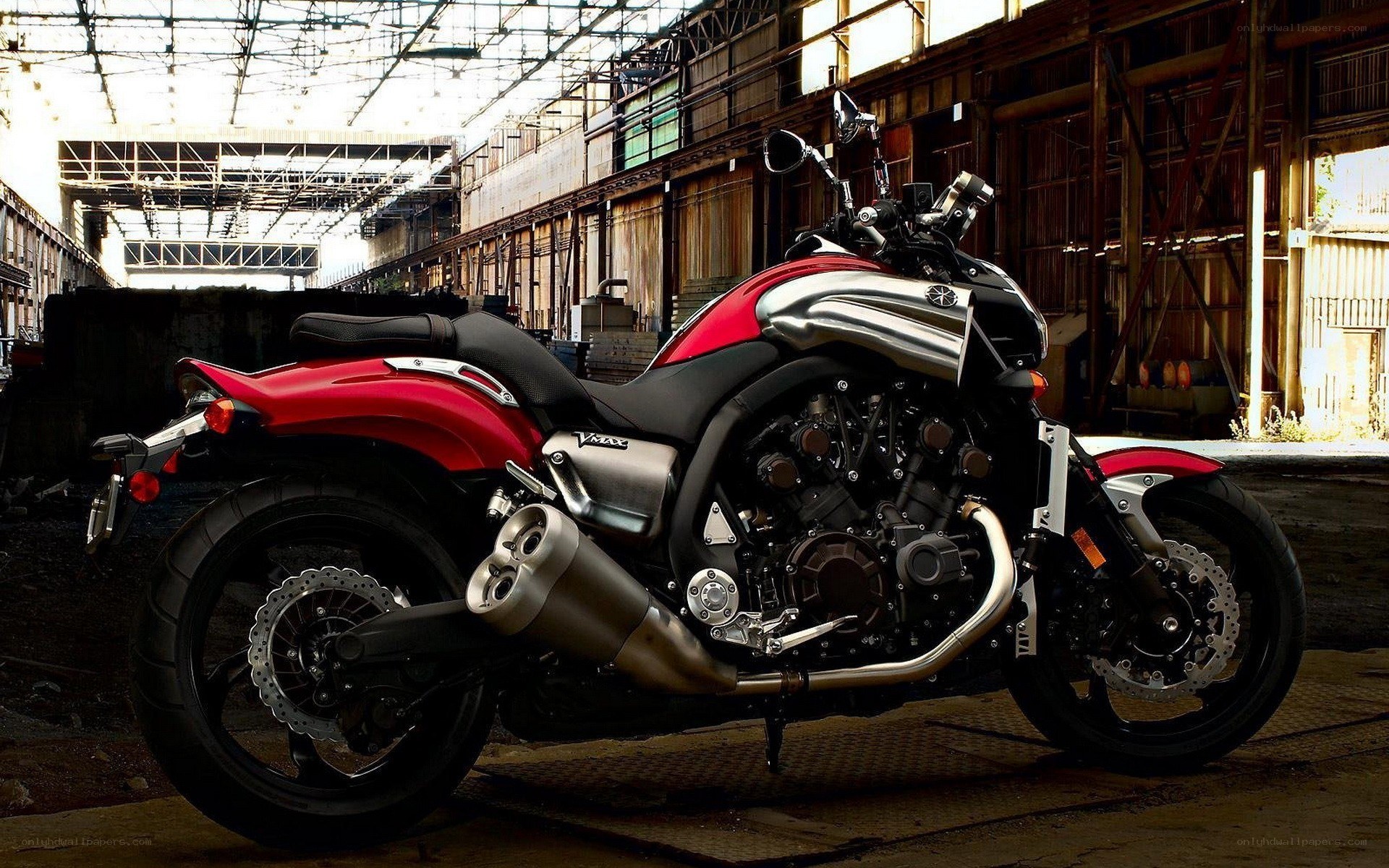 Red and silver motorcycle in warehouse
