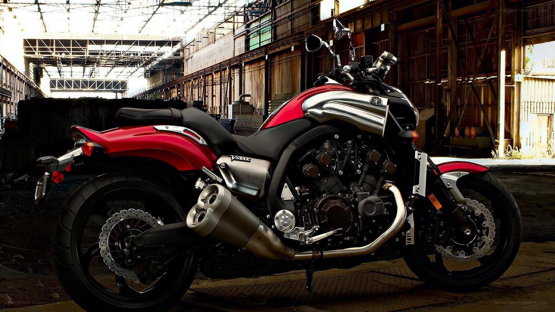 Red and silver motorcycle in warehouse