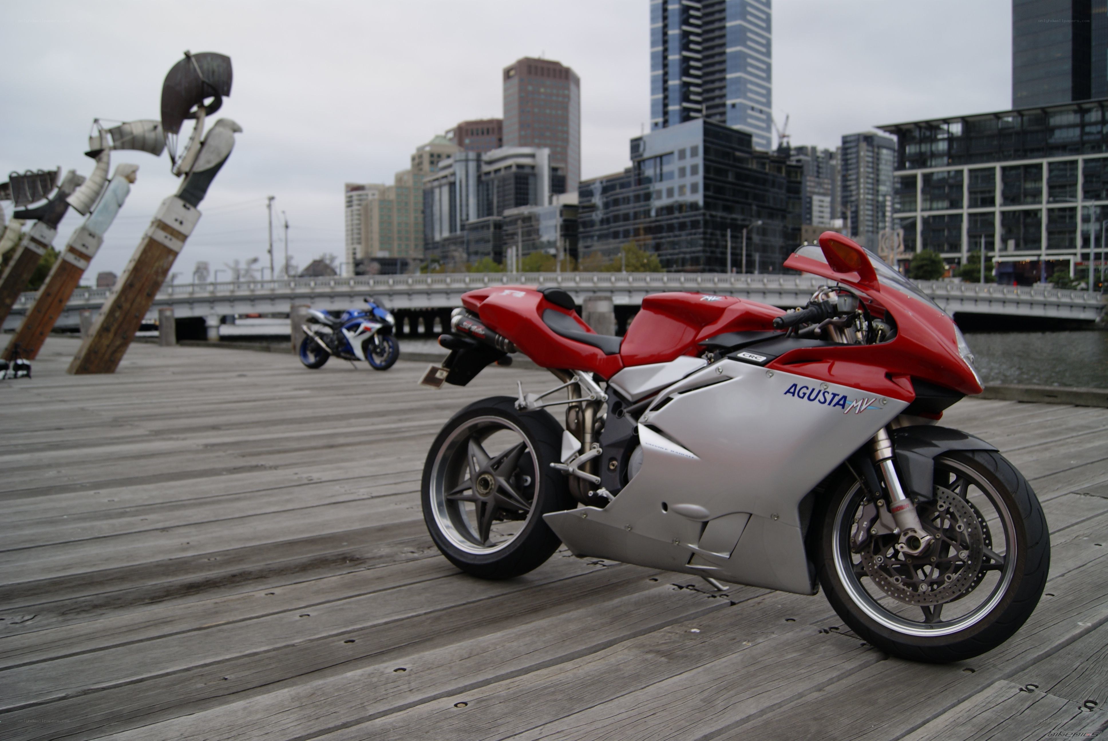 Red and silver motorcycle on a dock