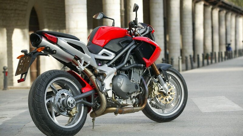 Red and silver motorcycle on street