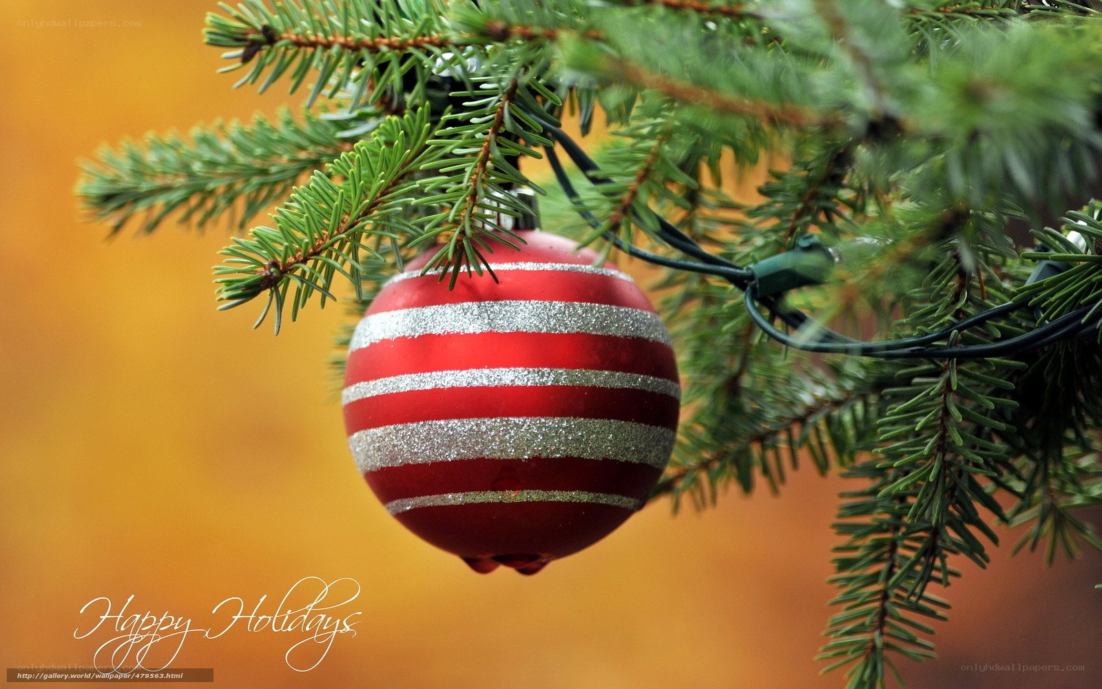 Red and silver ornament on tree