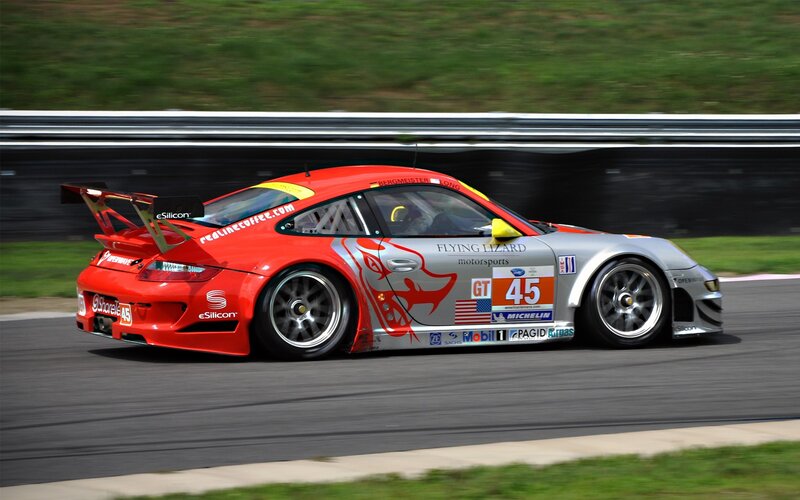 Red and silver race car on track