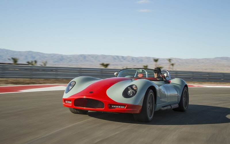 Red and silver sports car on track