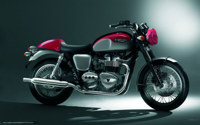 Red and silver Triumph motorcycle