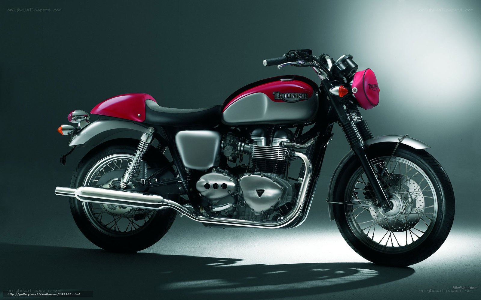 Red and silver Triumph motorcycle