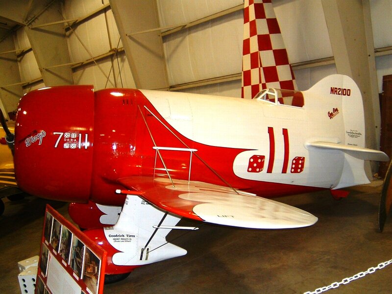 Red and white aerobatic plane