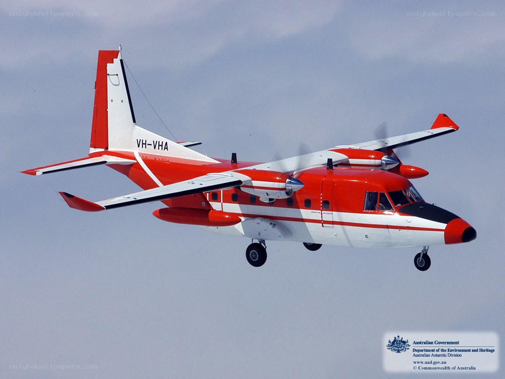 Red and white aircraft in flight