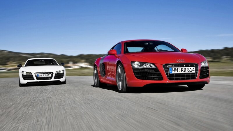 Red and white Audi R8 sports cars