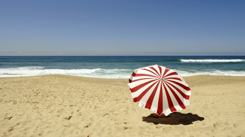 Red and white beach umbrella