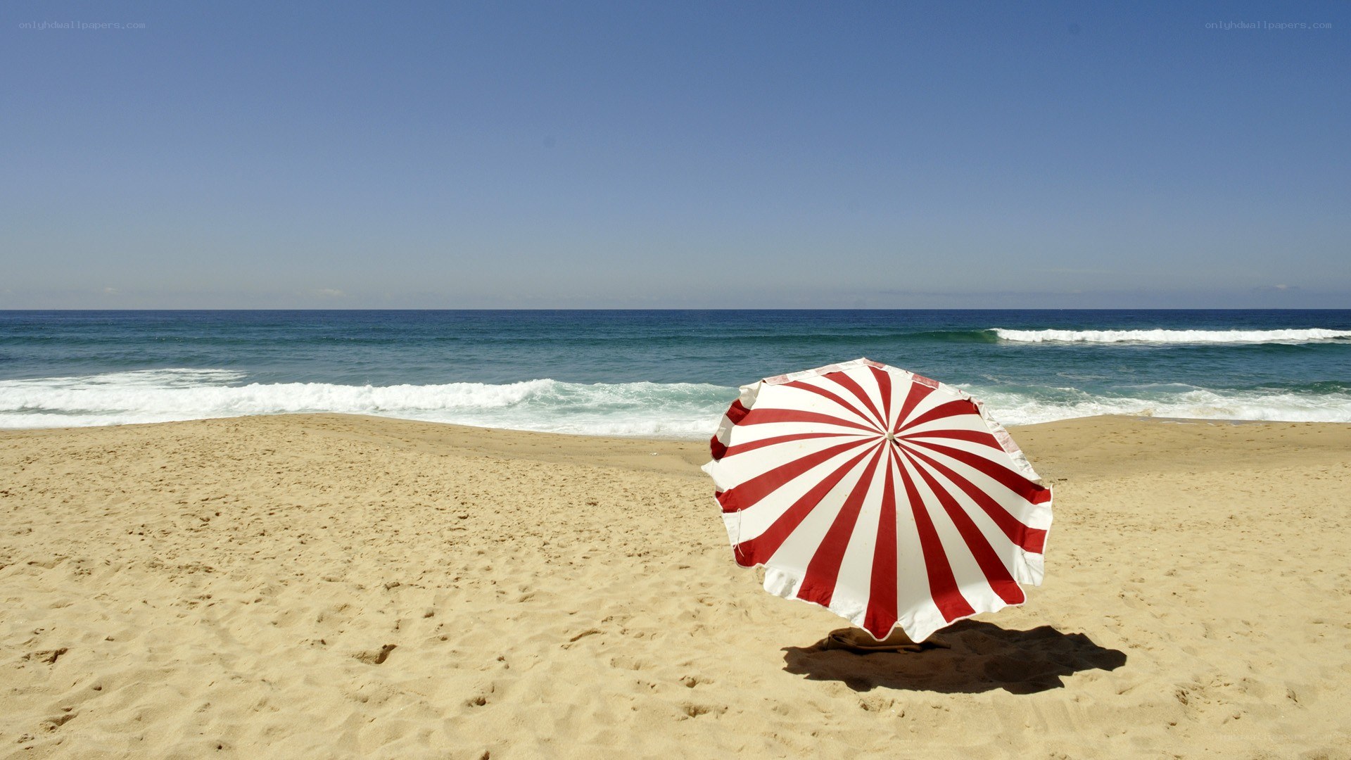 Red and white beach umbrella