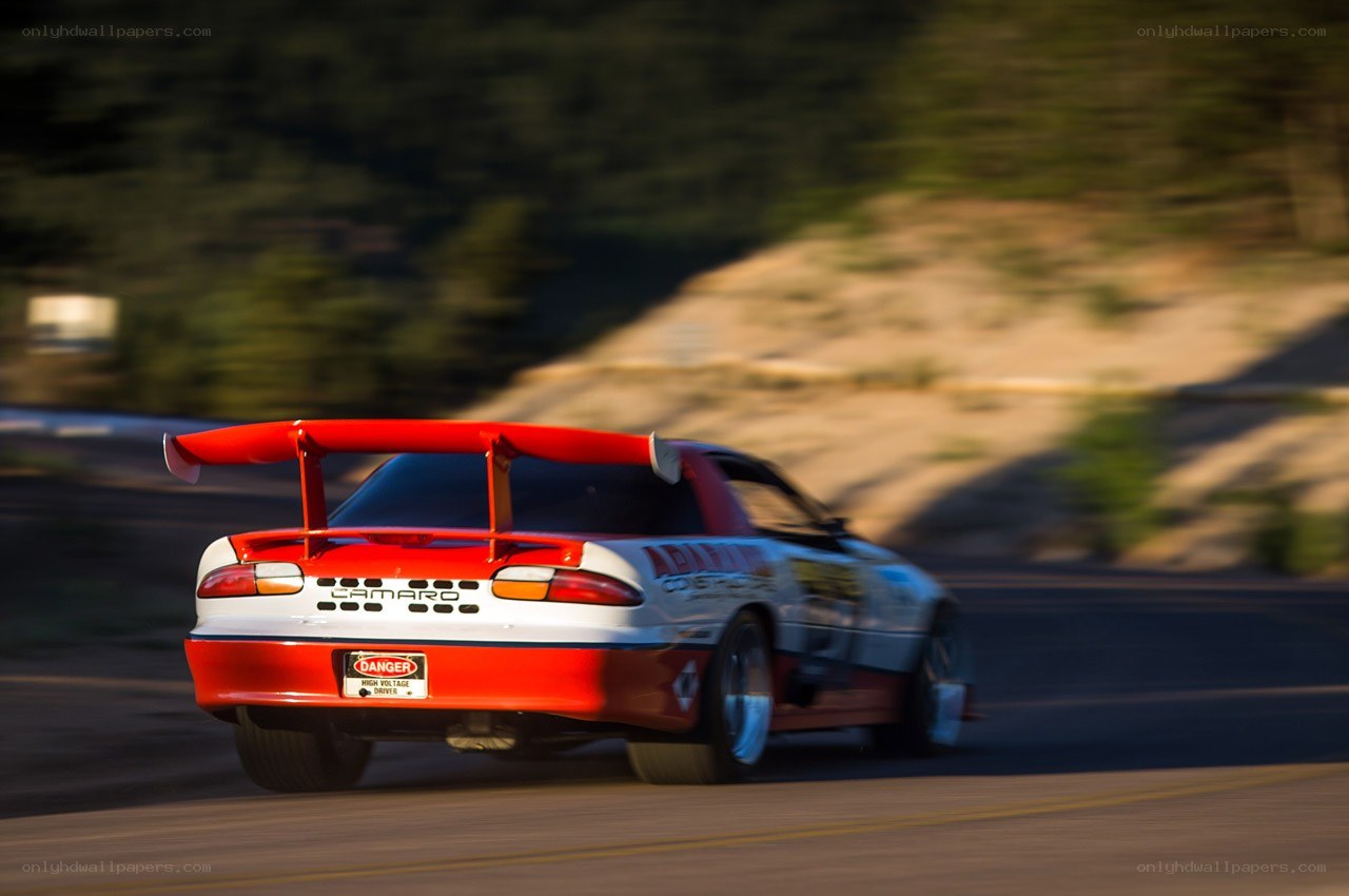 Red and white Camaro racing