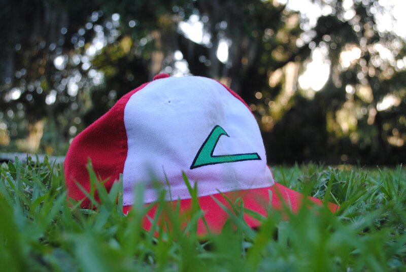 red and white cap in grass