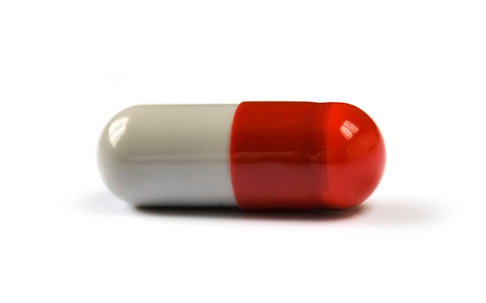 red and white capsule pill