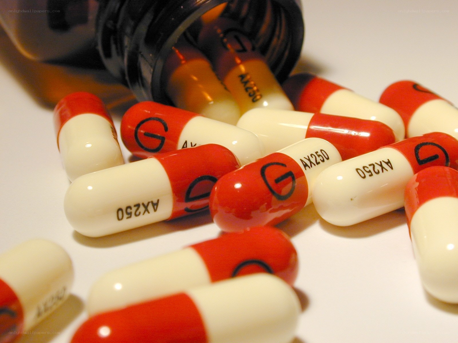 red and white capsules spilled