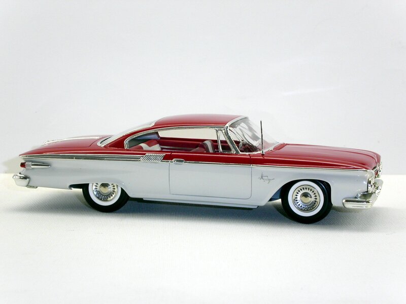 red and white classic car model