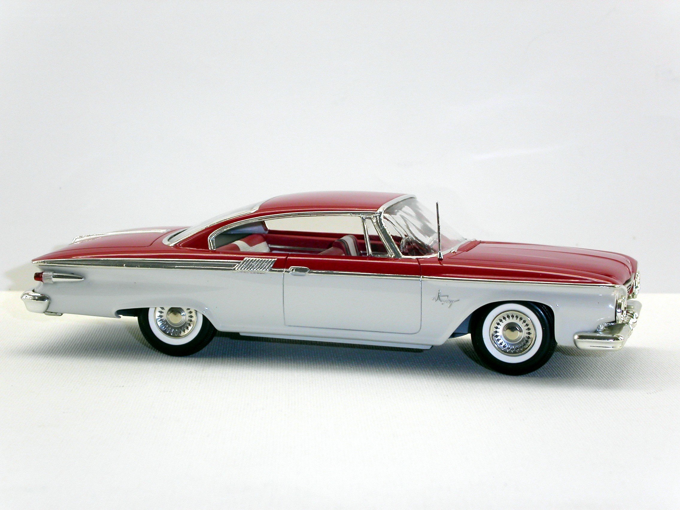 red and white classic car model