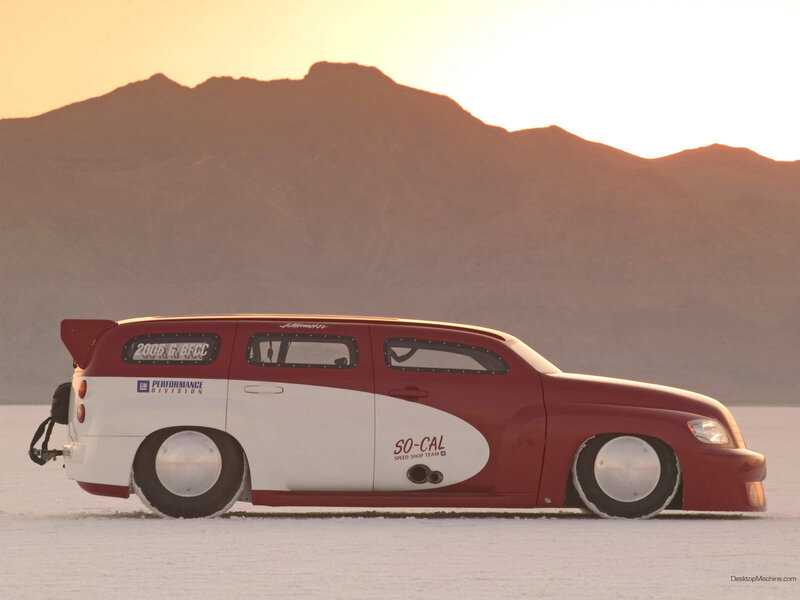 Red and white custom car on salt flat