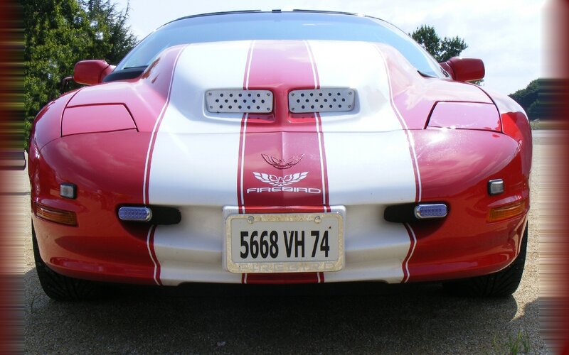 red and white firebird car