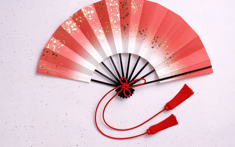 red and white folding fan