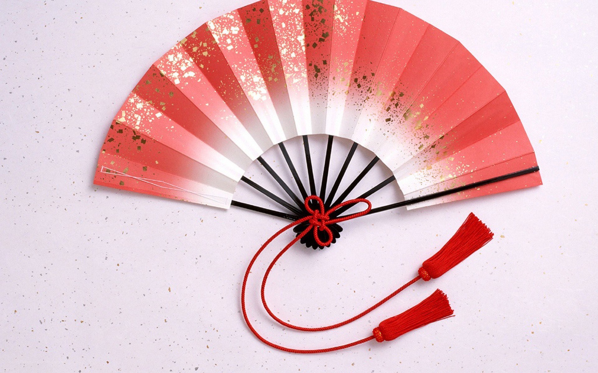 red and white folding fan