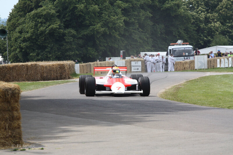 Red and White Formula One Car — Active, Afternoon