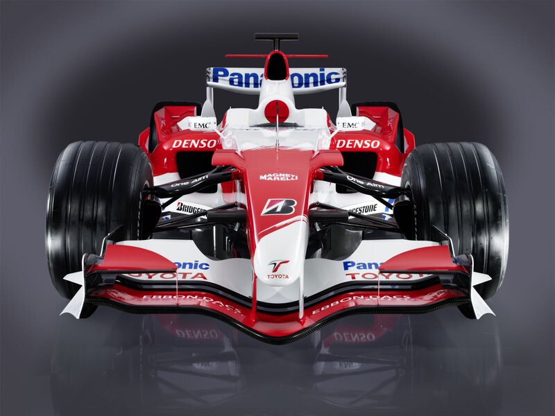 Red and White Formula One Car — Dramatic
