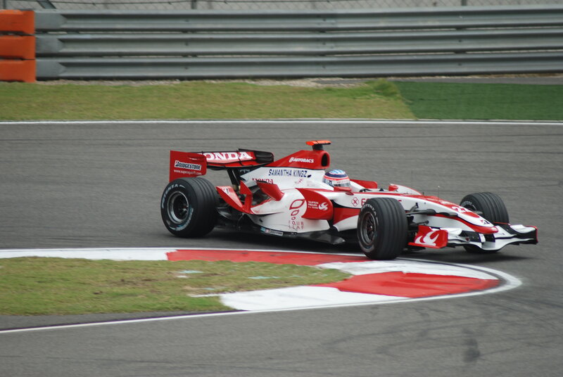 Red and White Formula One Car — Dynamic, Photograph