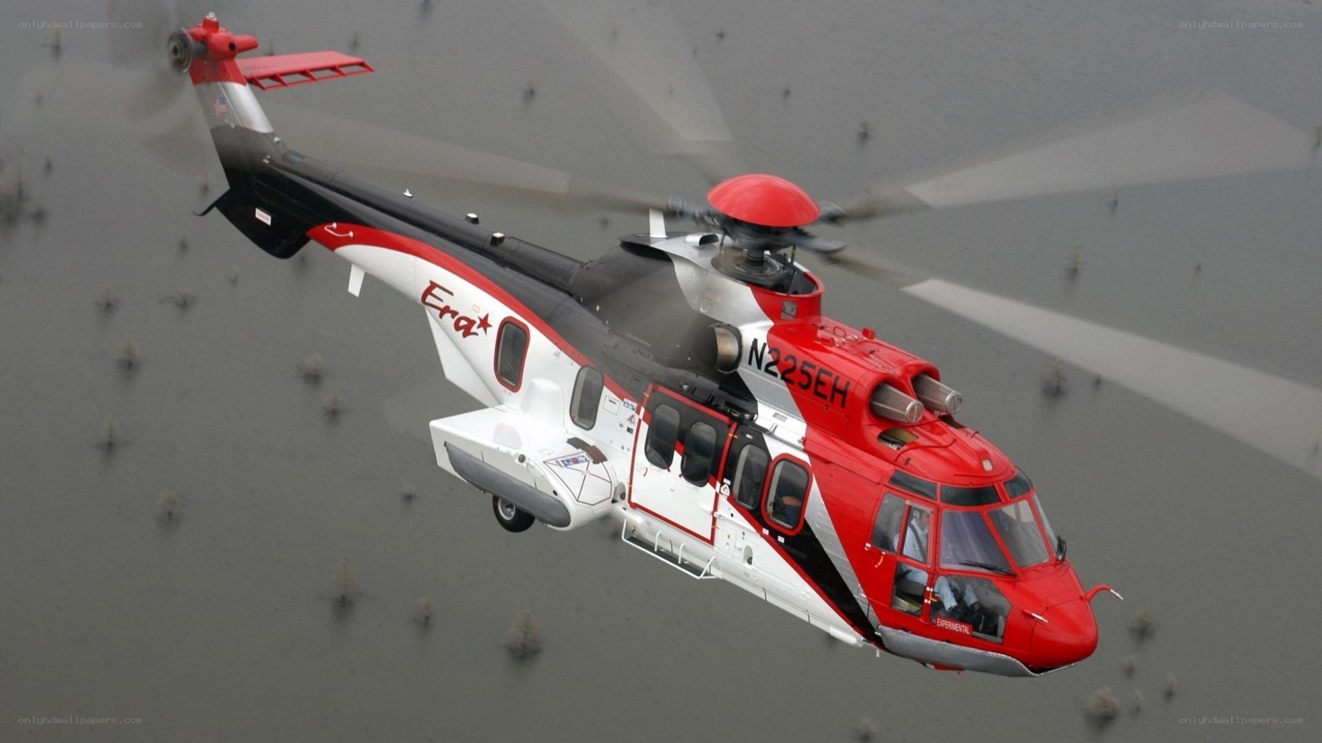 Red and white helicopter in flight