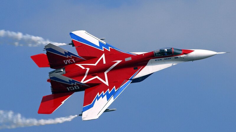 Red and White Jet Fighter — Dynamic, Afternoon, Photograph, Smoke Trails, Star Emblem