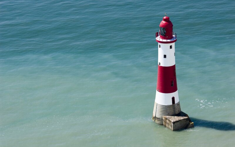 Red and White Lighthouse — Blue, Serene, Afternoon, Photograph, Ocean, Sky, Concrete Base