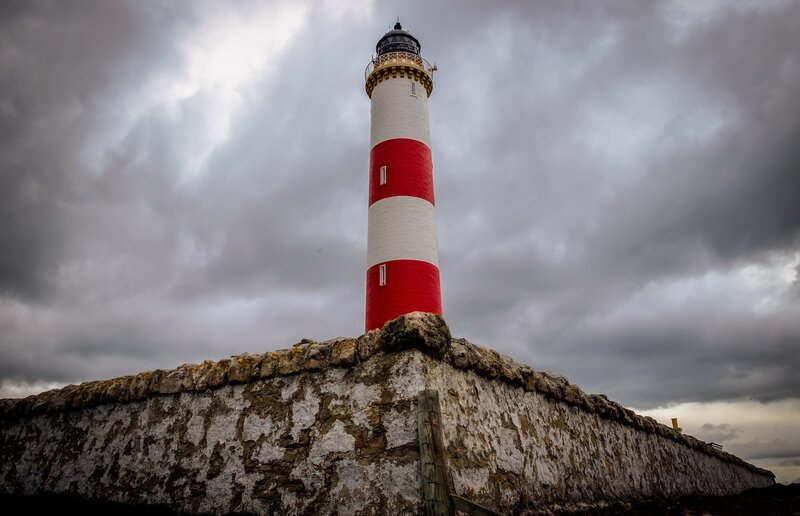 Red and White Lighthouse — Gray, Dramatic