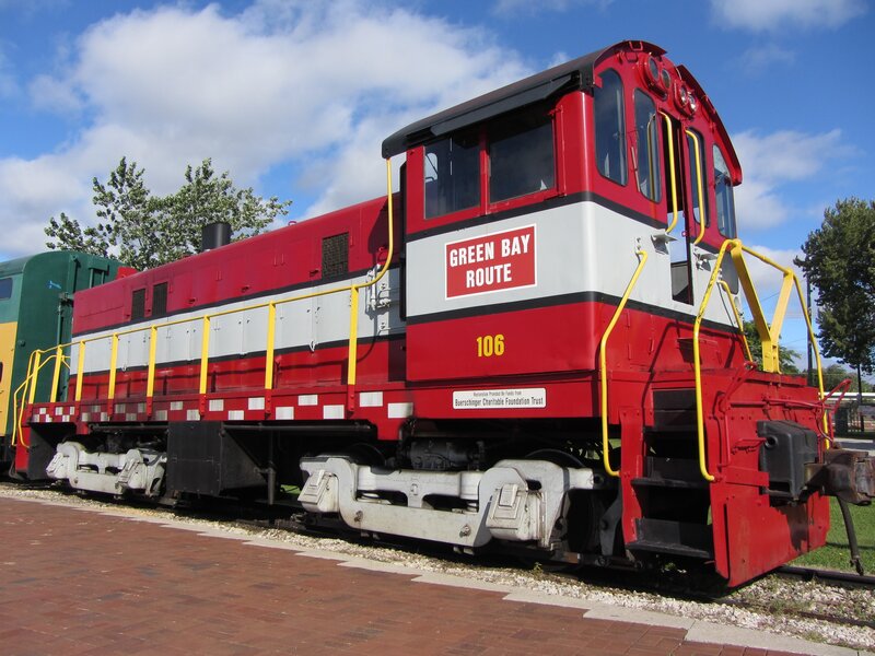 Red and white locomotive on display