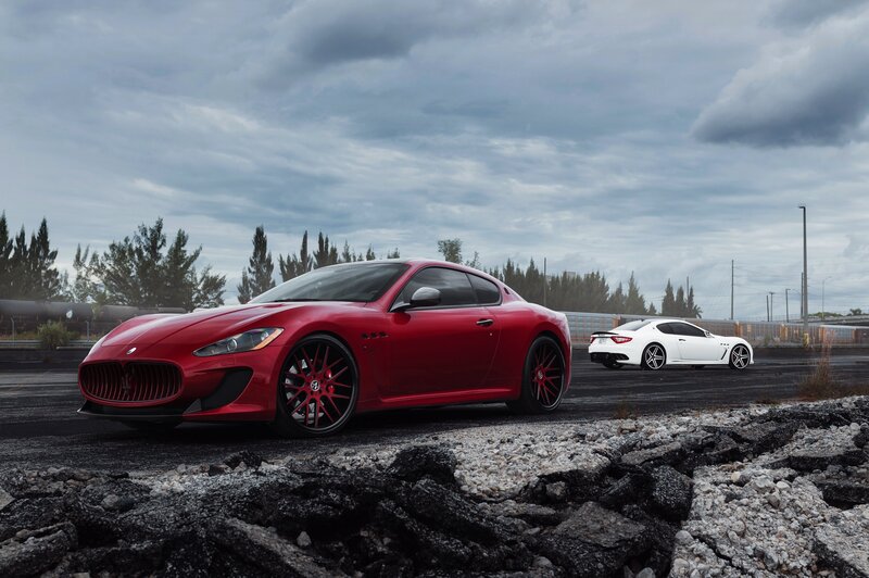 Red and white Maserati sports cars