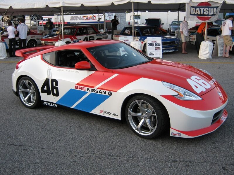 Red and white race car at show