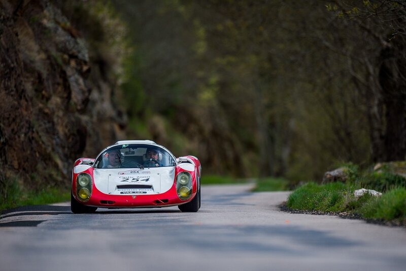 Red and white race car on a road
