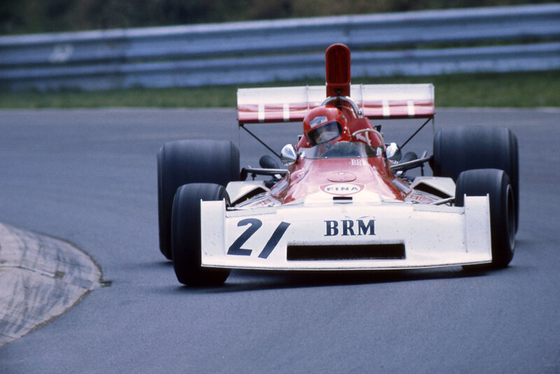 Red and white race car on track