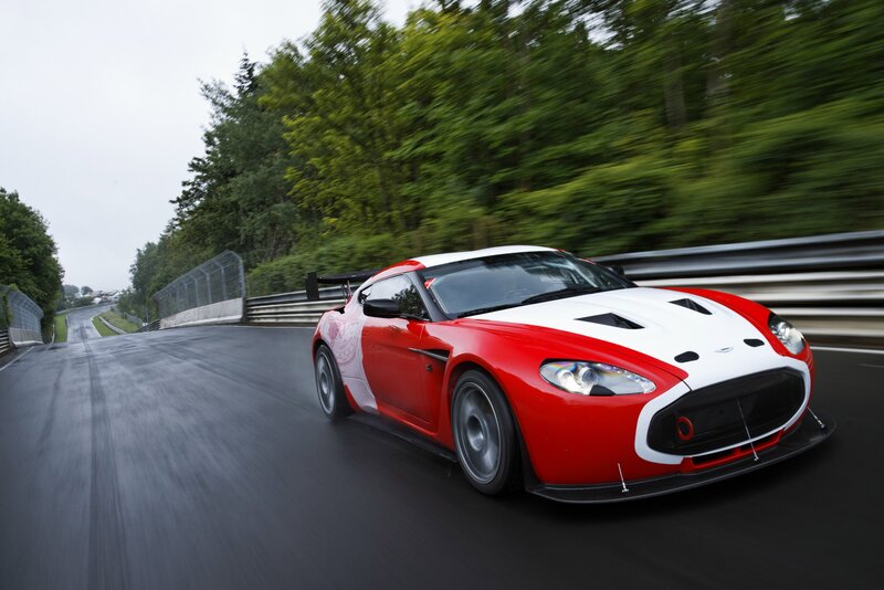 Red and white race car on track