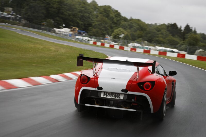 Red and white race car on track