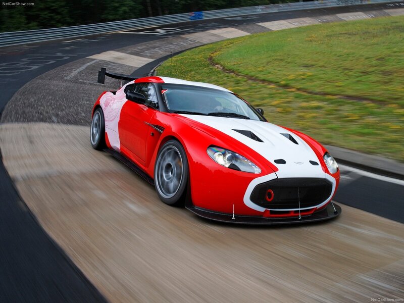 Red and white race car on track