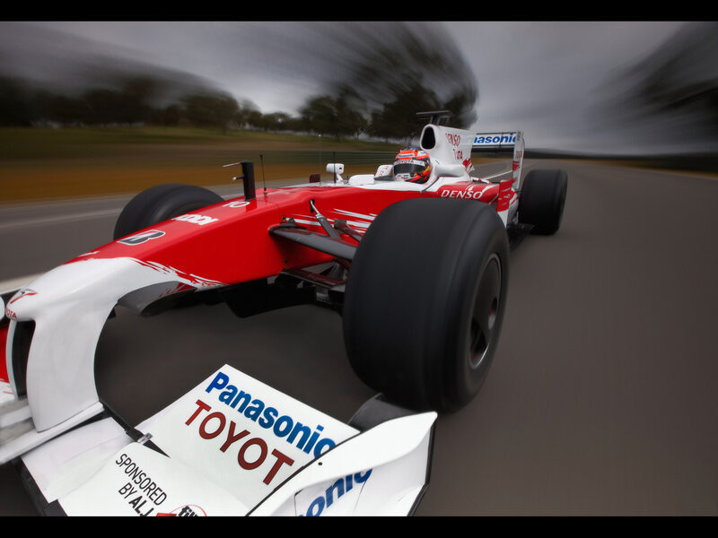 Red and white race car on track