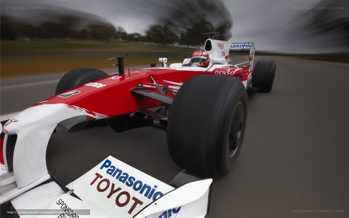 Red and white race car on track
