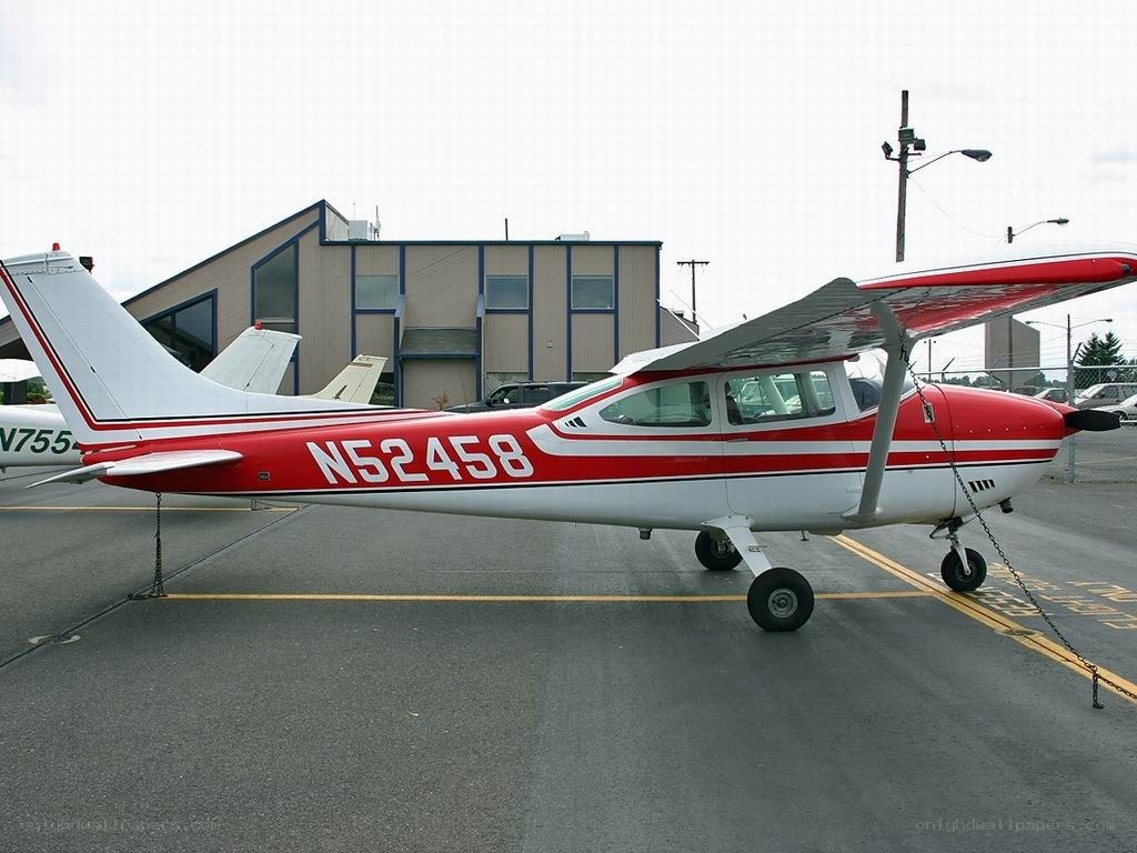 Red and white single-engine airplane