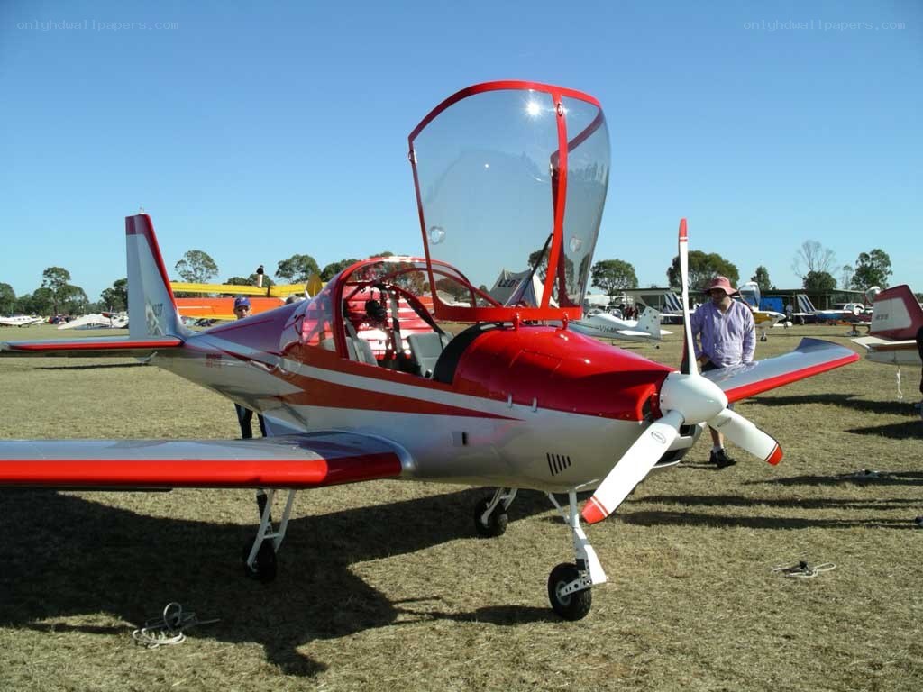 Red and white single-engine plane