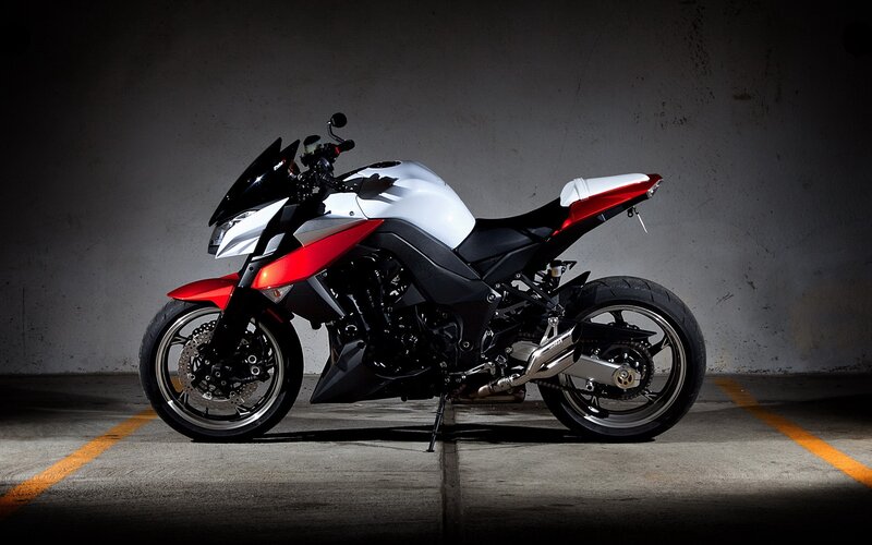 red and white sport motorcycle