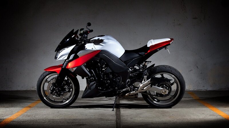 red and white sport motorcycle
