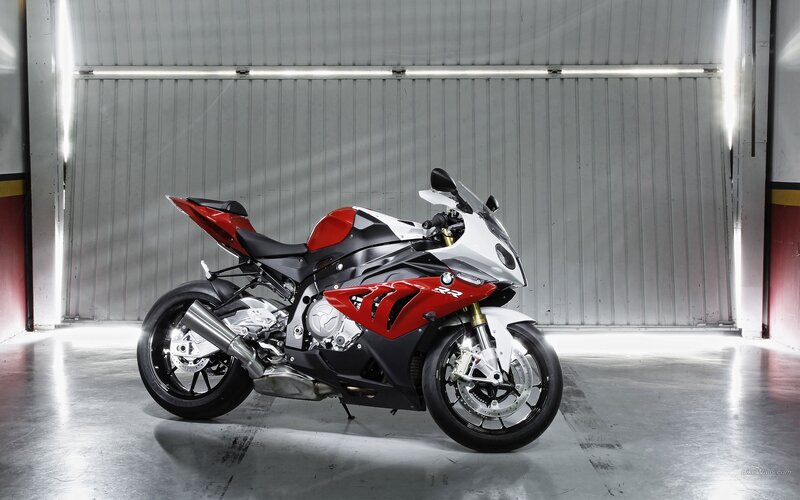 red and white sport motorcycle