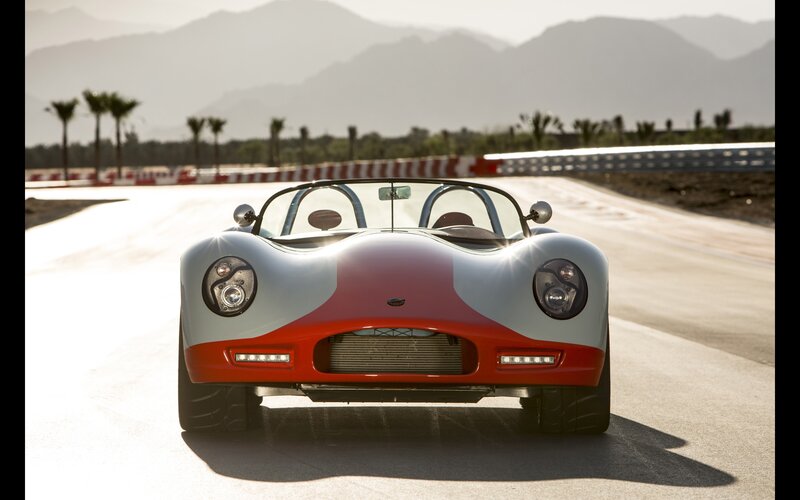 red and white sports car on track