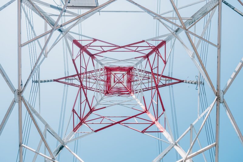 Red and White Transmission Tower — Blue