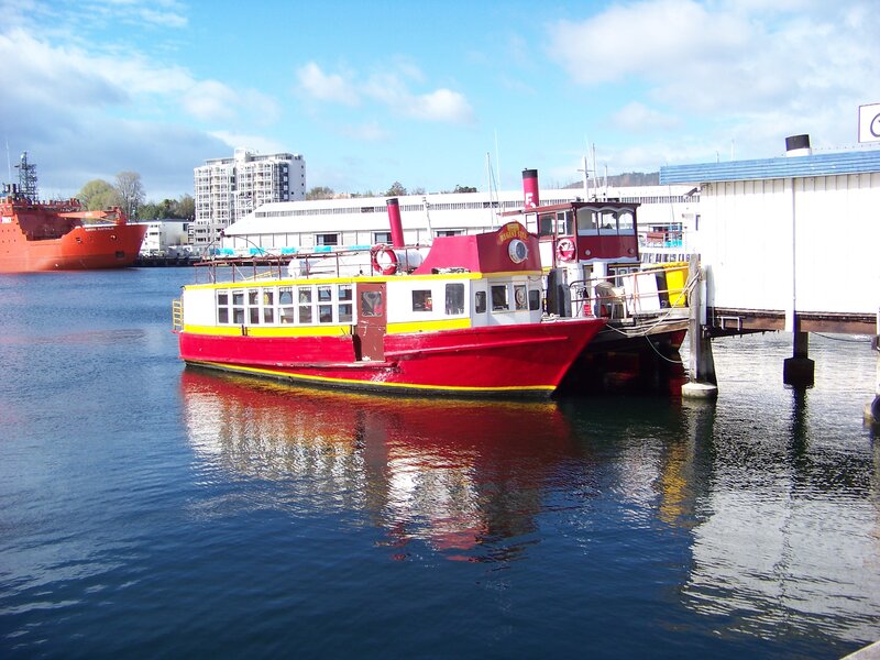 Red and yellow ferry at dock